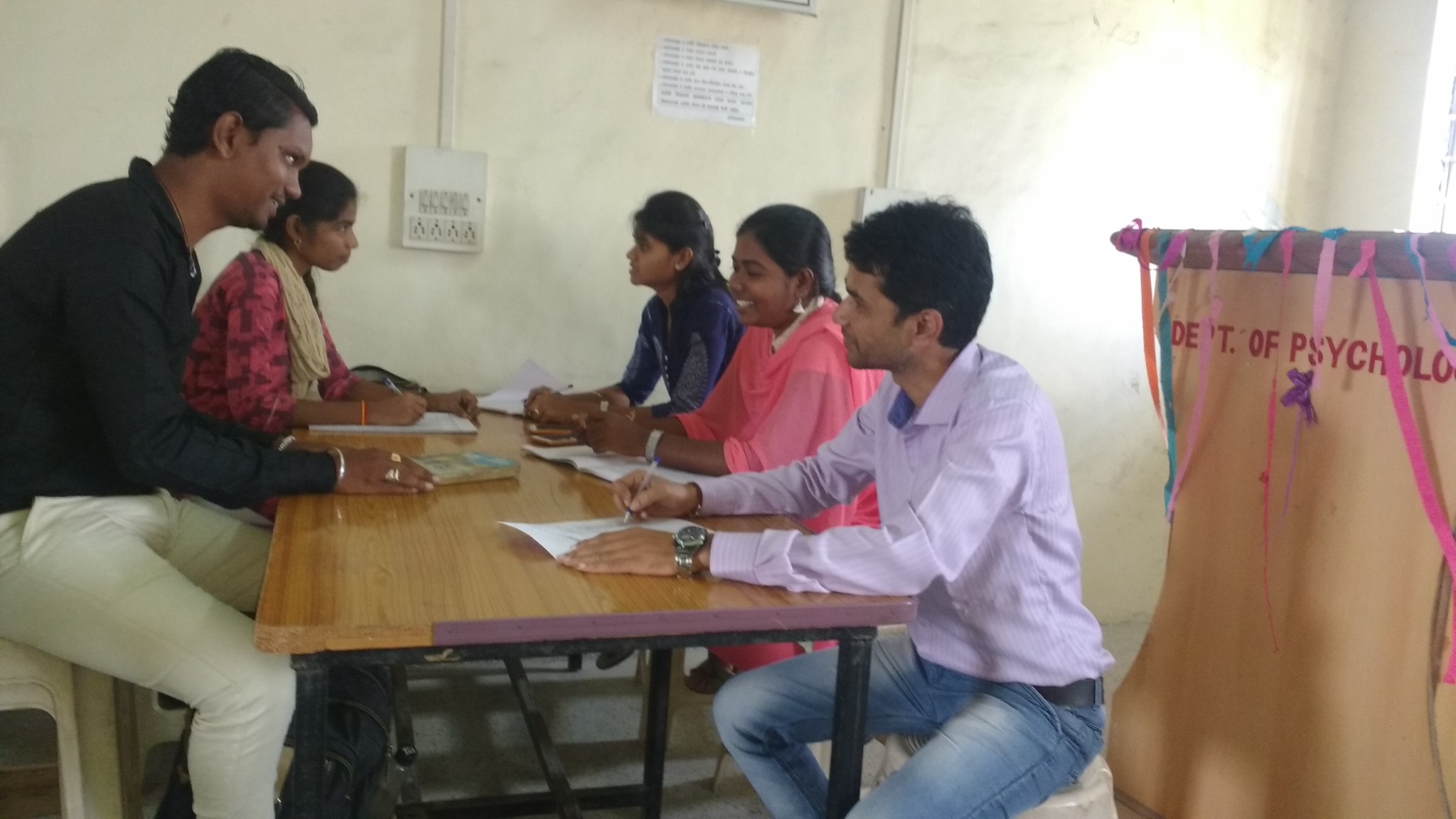 Research guidance discussion with students in 2018